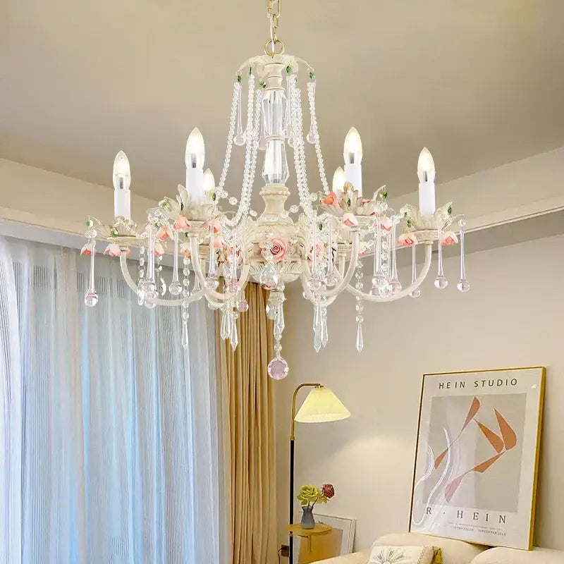 Elegant white decorbites crystal chandelier with delicate pink roses and teardrop crystals for romantic living rooms