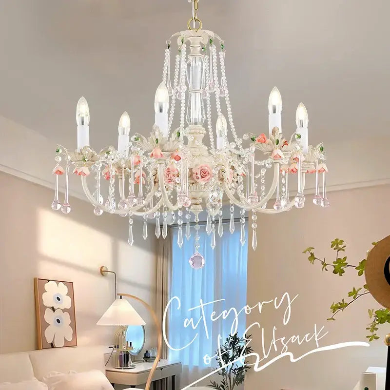 Elegant white decorbites crystal chandelier with delicate pink roses and teardrop crystals for romantic living rooms
