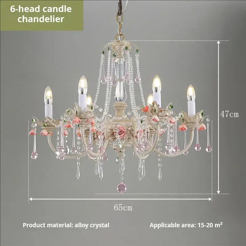 An elegant off-white DecorBites crystal chandelier with six candle lights and pink rose crystal accents for romantic rooms