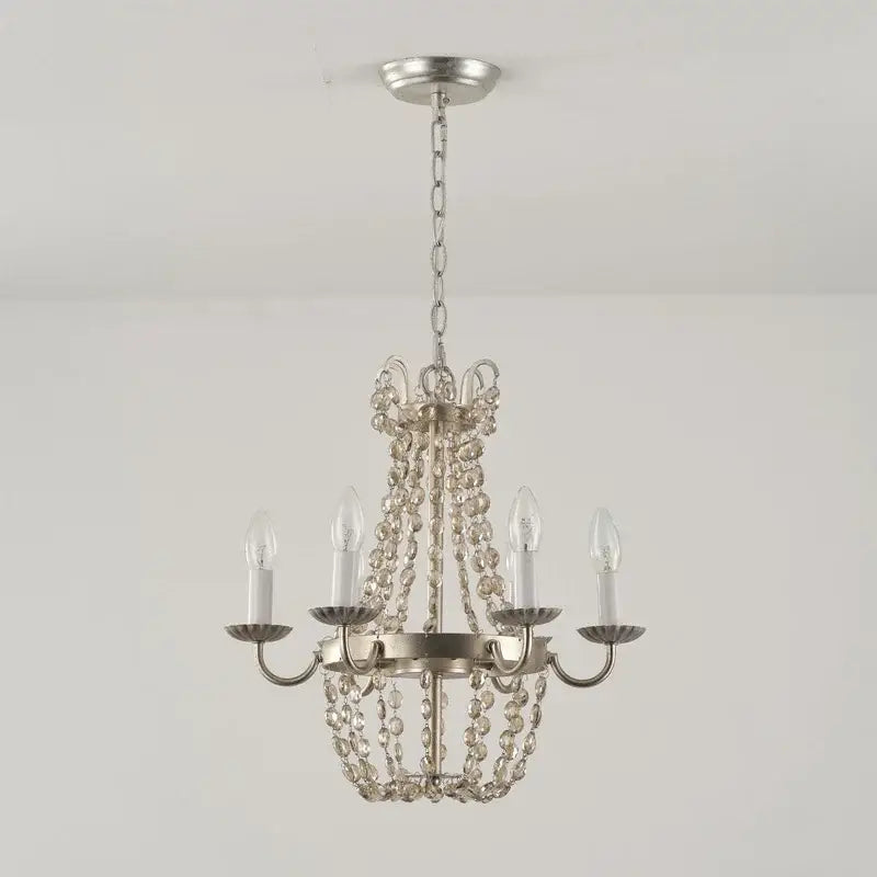 Silver-finished decorbites crystal chandelier with cascading clear beads and five candle-style bulbs for elegant lighting