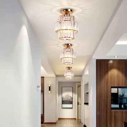 Gold-toned decorbites crystal chandelier featuring cascading crystal tiers with elegant LED lighting for living rooms and bedrooms