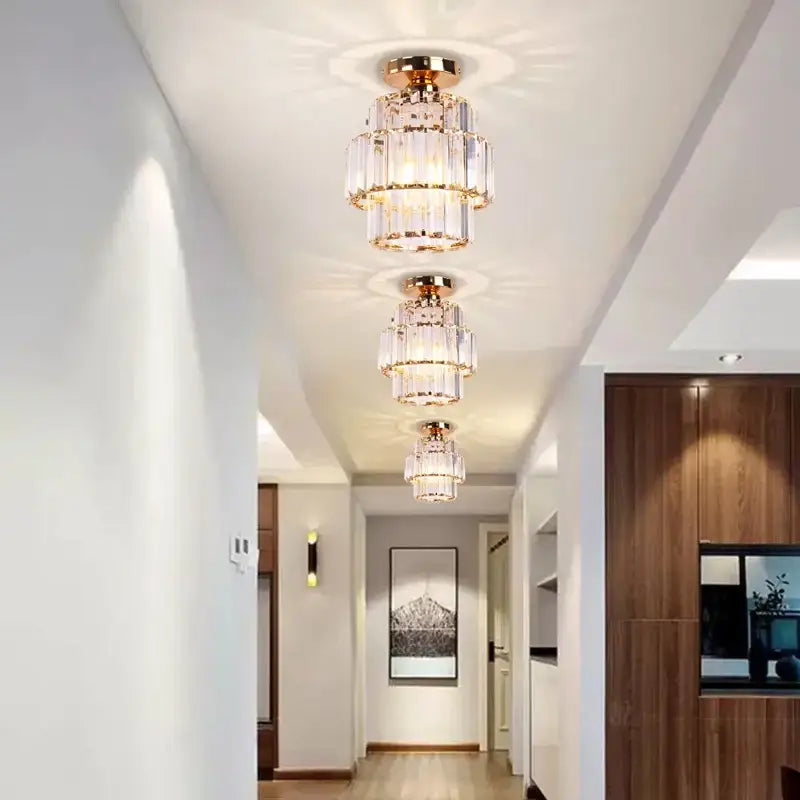 Gold-toned decorbites crystal chandelier featuring cascading crystal tiers with elegant LED lighting for living rooms and bedrooms