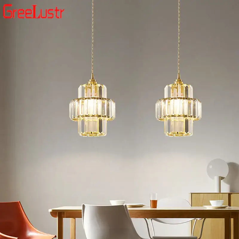 Gold-toned decorbites crystal chandelier with tiered design and hanging chains for elegant living room lighting