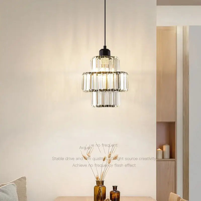 A decorbites crystal chandelier with clear faceted glass rods and black metal fixture for elegant modern lighting