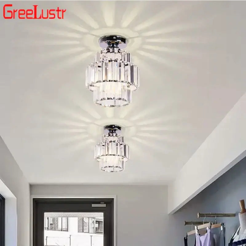 Chrome-finished decorbites crystal chandelier with tiered faceted glass elements for elegant modern ceiling lighting