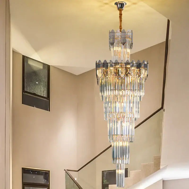 Decorbites crystal chandelier with cascading clear and frosted glass rods and brass finish for luxury interiors