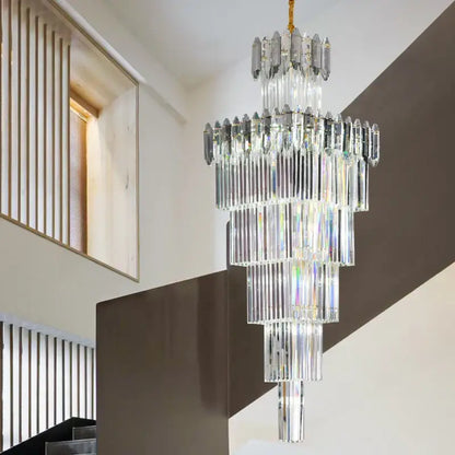 A decorbites crystal chandelier with multi-tiered cascading clear and frosted glass rods on a gold-toned chain