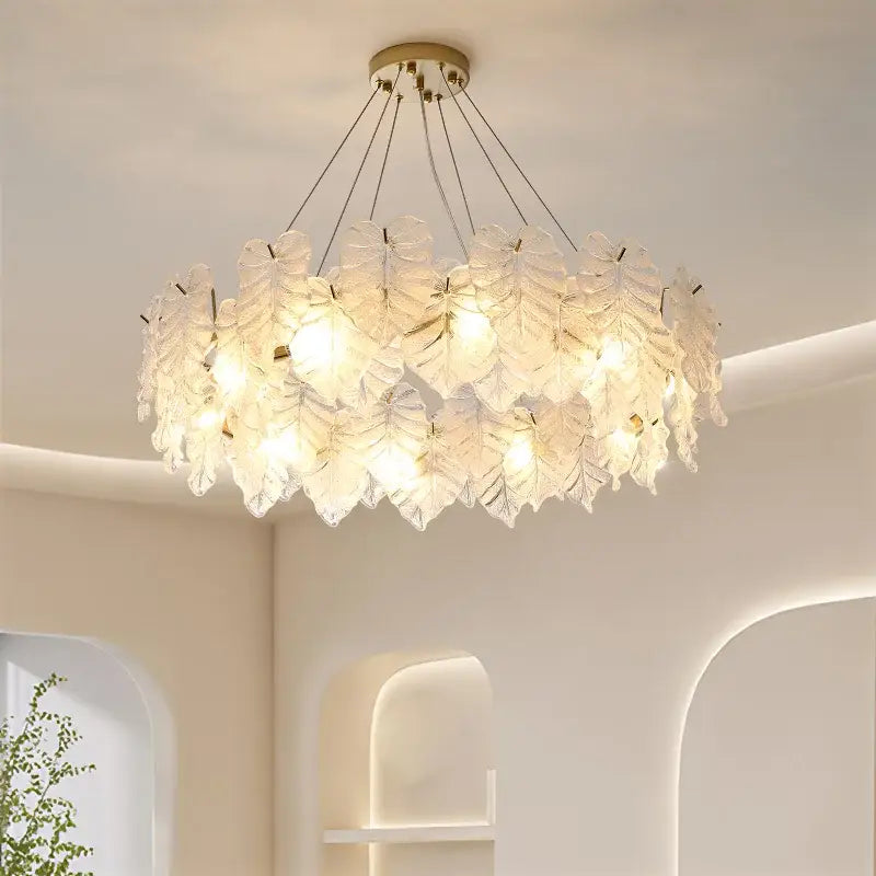 Elegant white glass leaf crystal chandelier with gold-toned ceiling mount by DecorBites for living and dining rooms