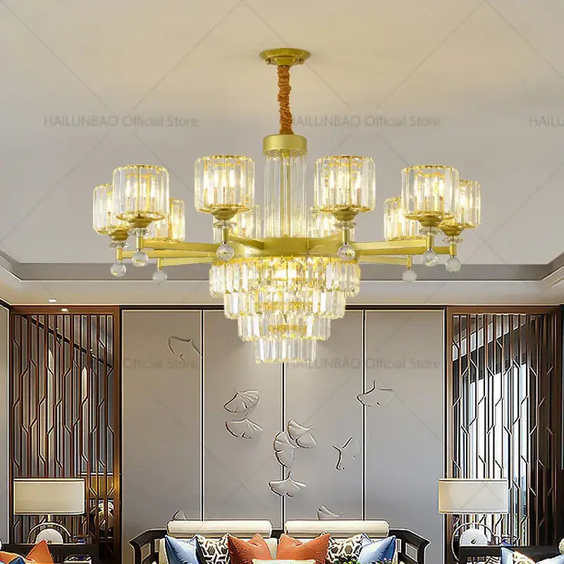 Gold-toned decorbites crystal chandelier with clear glass shades and dangling crystals for luxury villa lighting