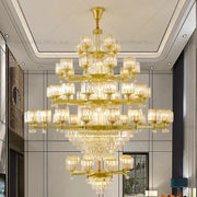 Golden multi-tiered decorbites crystal chandelier with clear glass shades and dangling crystals for elegant living rooms