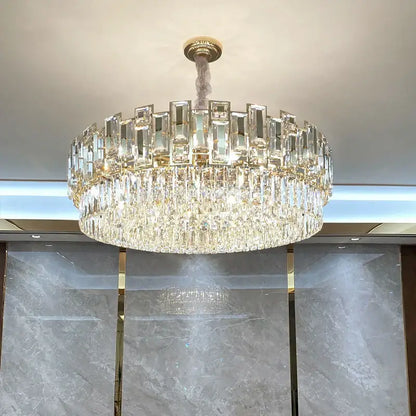 Luxurious two-tiered decorbites crystal chandelier with gold-toned mount and clear prisms ideal for living room lighting