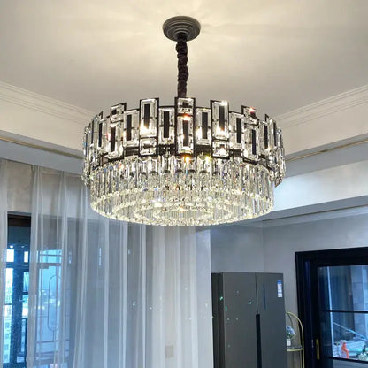 A modern decorbites crystal chandelier with dark metal frame rectangular crystals and clear glass prisms for elegant lighting