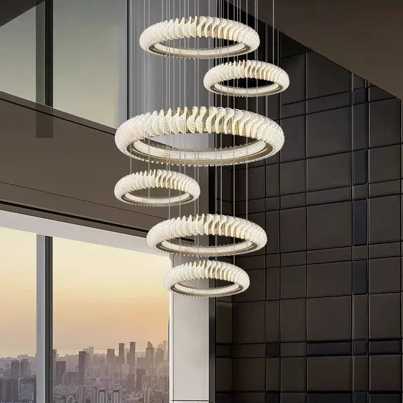 Modern white crystal chandelier with cascading circular rings for elegant living and dining rooms by decorbites crystal chandelier