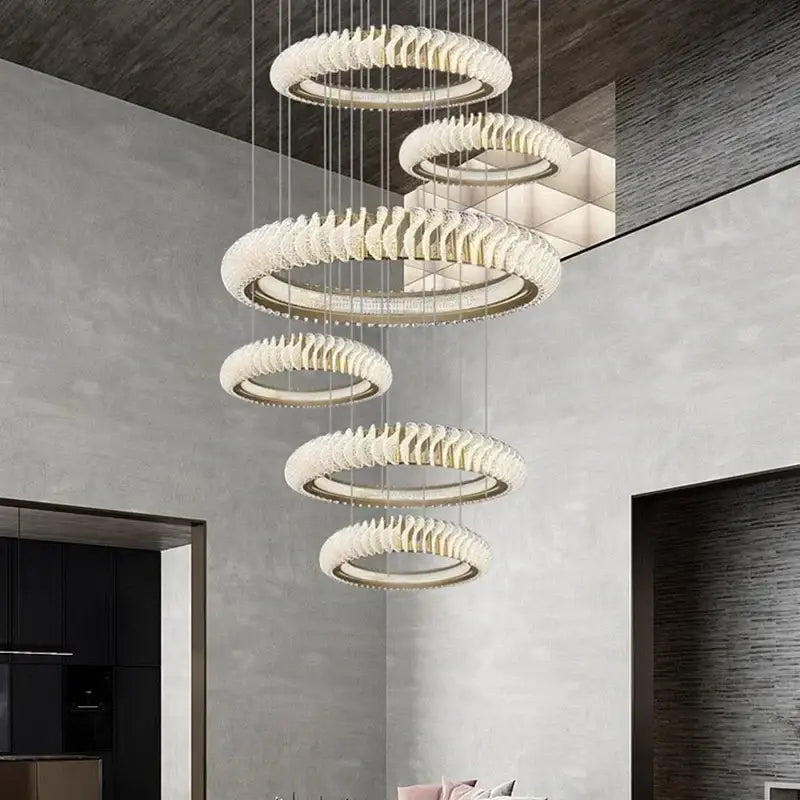 Modern tiered DecorBites crystal chandelier with frosted crystal rings and metallic accents for elegant living and dining rooms