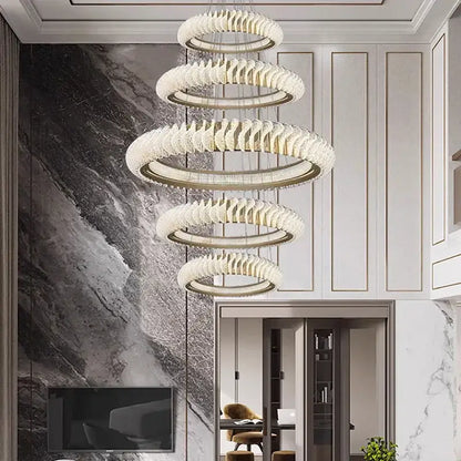 Decorbites crystal chandelier featuring modern spiral concentric rings with faceted crystal finish and warm led lights