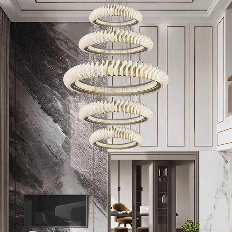 Decorbites crystal chandelier featuring modern spiral concentric rings with faceted crystal finish and warm led lights