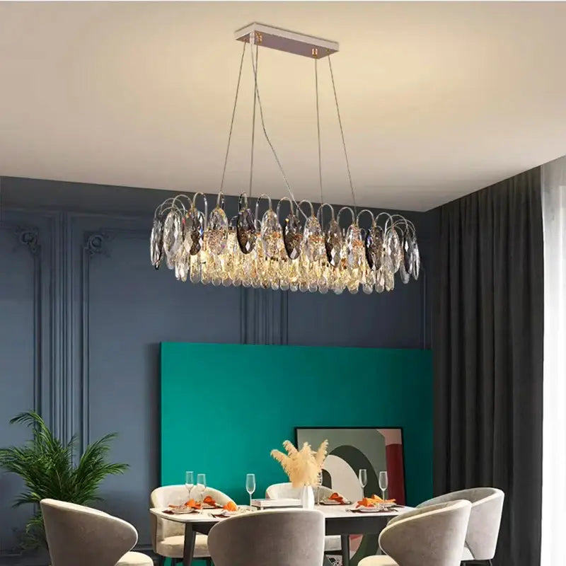 A decorbites crystal chandelier pendant light with clear crystal teardrop pendants and a sleek rectangular ceiling mount