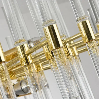 Decorbites crystal chandelier featuring clear glass rods and polished gold-toned metal pendant lighting for luxury spaces