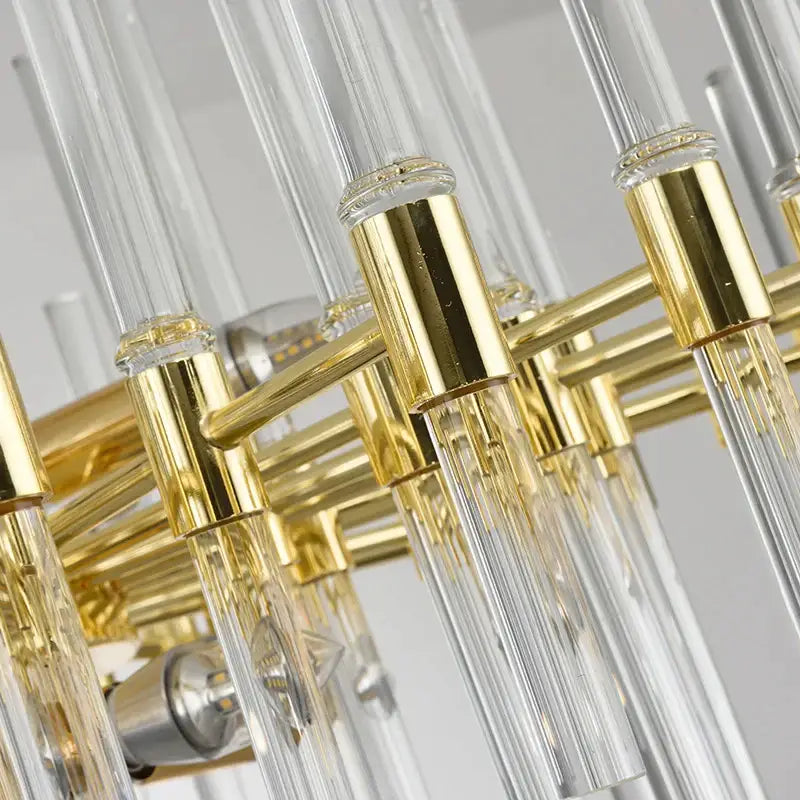 Decorbites crystal chandelier featuring clear glass rods and polished gold-toned metal pendant lighting for luxury spaces