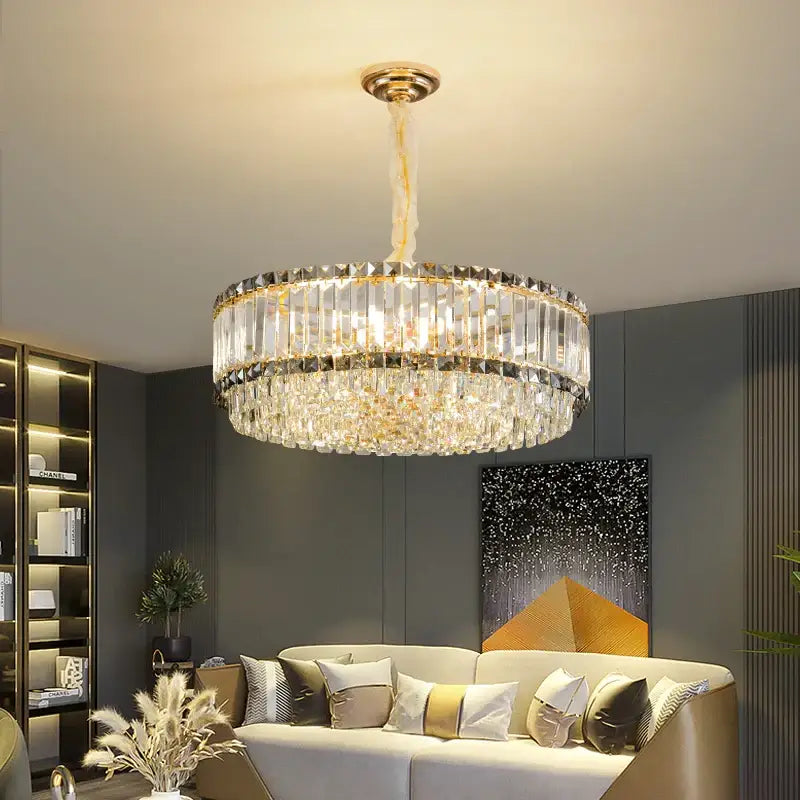 A modern two-tiered decorbites crystal chandelier with gold fixture and clear faceted glass rods for elegant lighting
