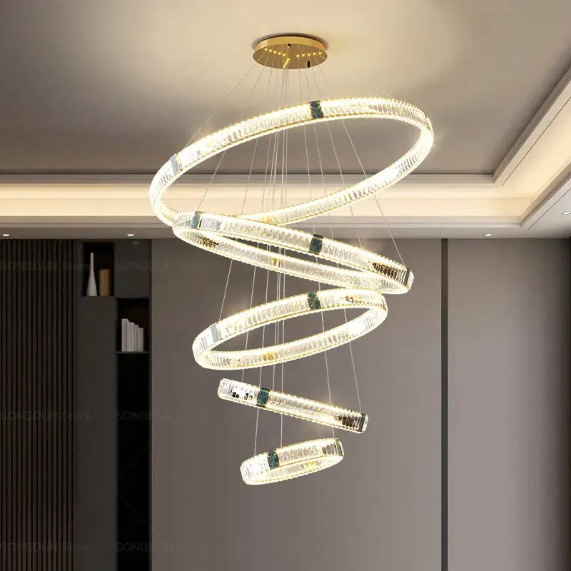 A modern decorbites crystal chandelier with glowing crystal rings and gold-toned ceiling mount for elegant lighting