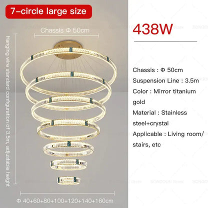 A decorbites crystal chandelier with seven concentric rings of crystal and stainless steel in mirror titanium gold finish