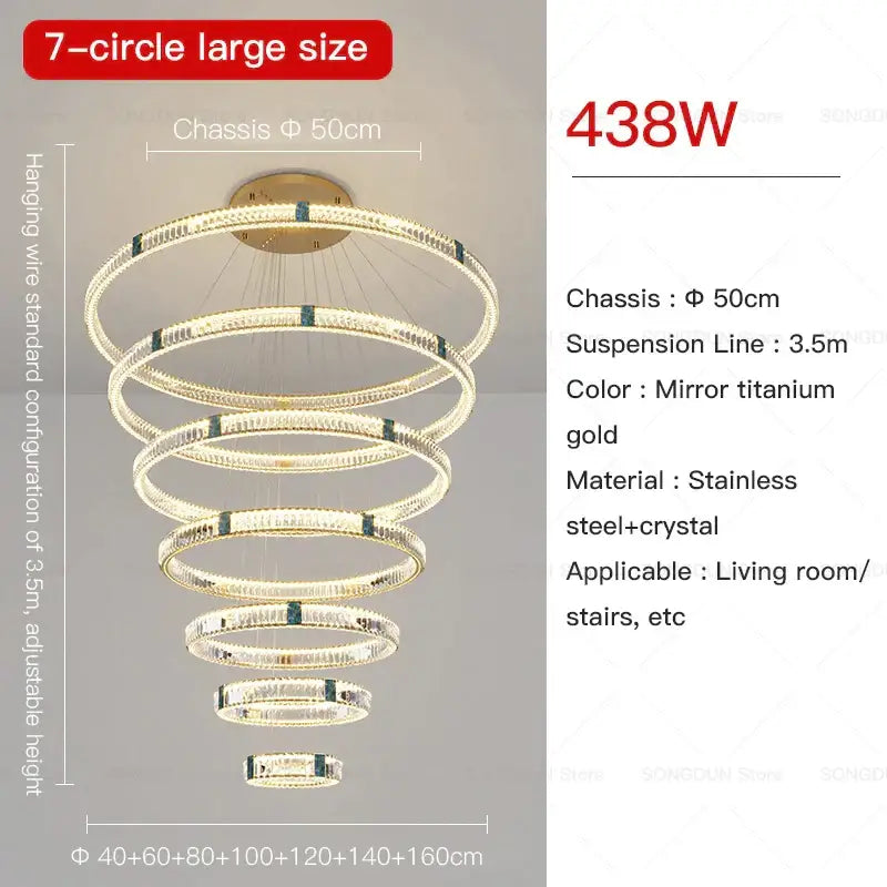 A decorbites crystal chandelier with seven concentric rings of crystal and stainless steel in mirror titanium gold finish