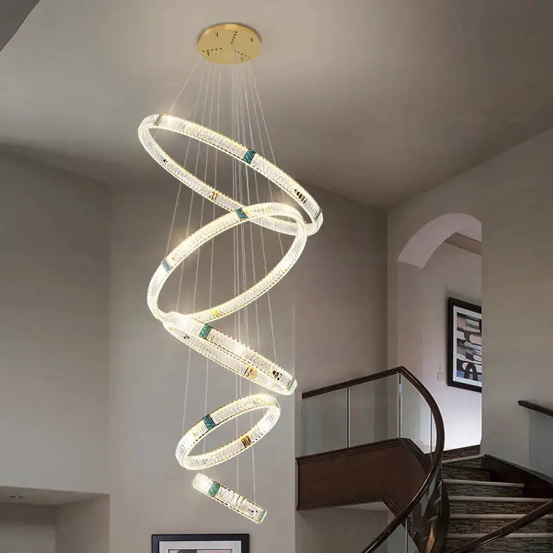 A modern decorbites crystal chandelier with glowing crystal-encrusted rings and green accents for elegant lighting