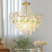 Decorbites crystal chandelier with golden finish and cascading crystal droplets accented by green glass orbs for elegant lighting