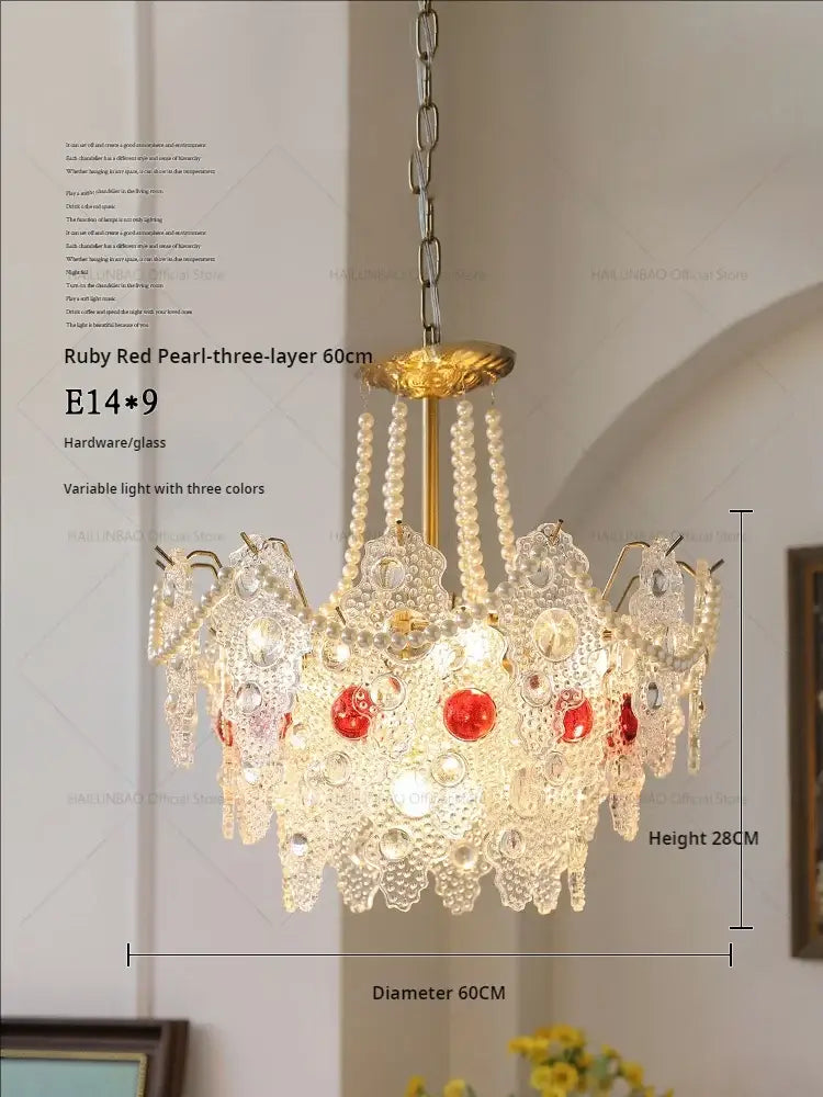 Elegant three-layer decorbites crystal chandelier with gold-toned hardware and ruby red pearl accents for home lighting