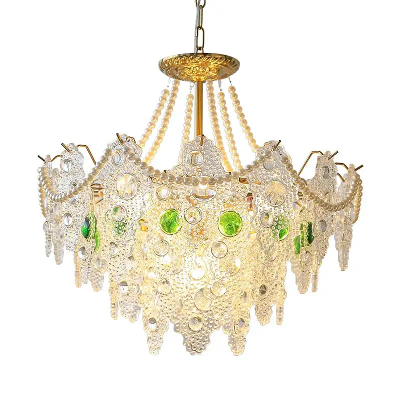 A decorbites crystal chandelier with gold-toned frame, clear and green glass pieces, and pearl strands for elegant lighting