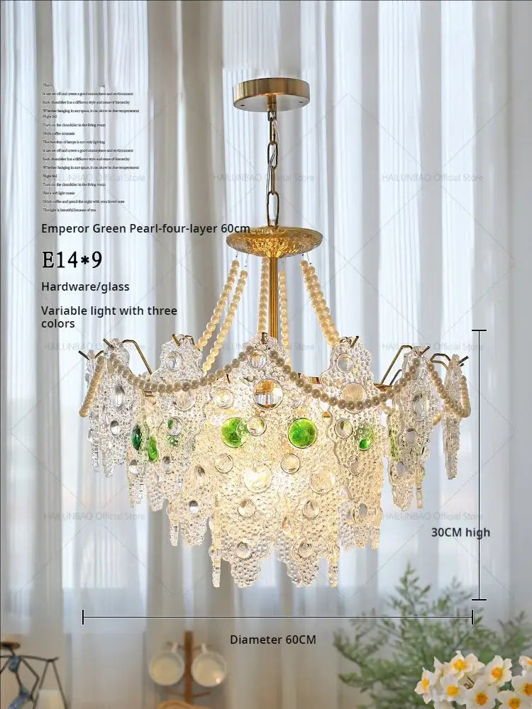 A luxurious four-layer decorbites crystal chandelier with golden brass frame, crystal beads, and emerald glass pearls