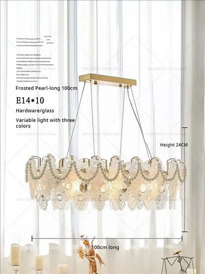 Frosted pearl decorbites crystal chandelier with gold-toned frame and glass panels lighting bedroom and living room