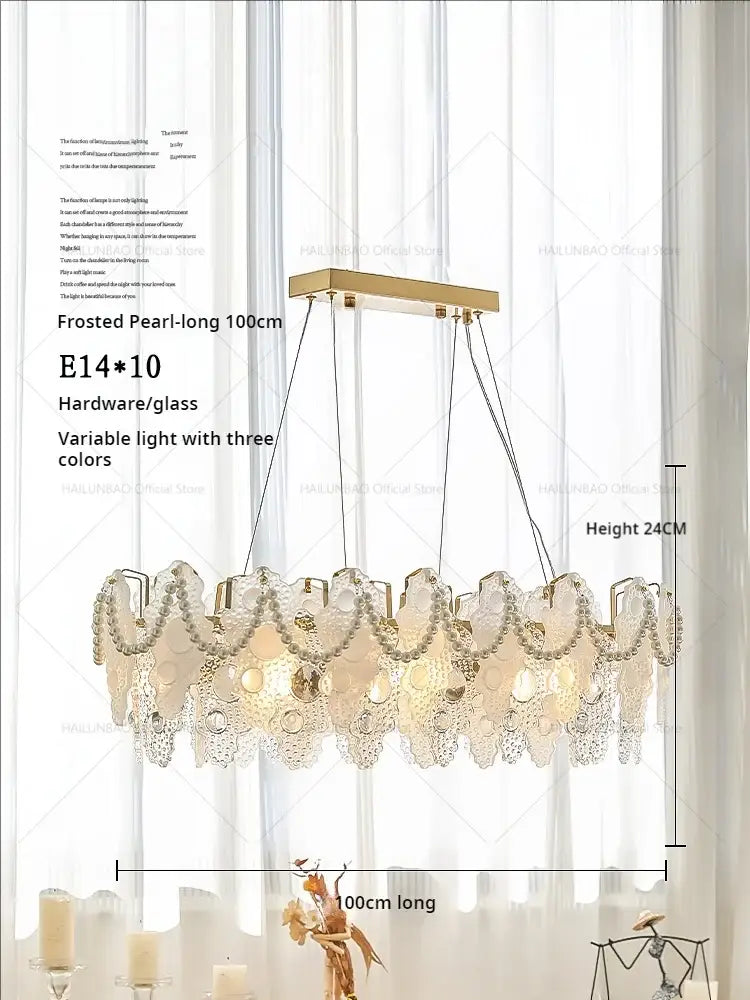 Frosted pearl decorbites crystal chandelier with gold-toned frame and glass panels lighting bedroom and living room