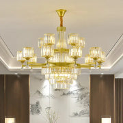 A luxurious gold-toned decorbites crystal chandelier with clear glass crystal shades for elegant living spaces