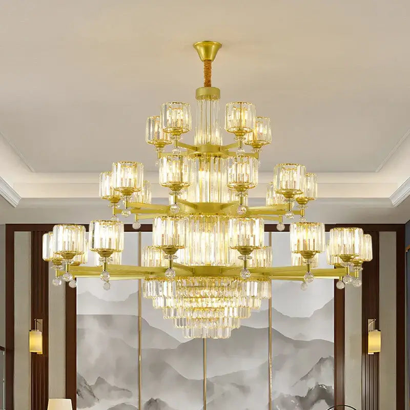 Golden decorbites crystal chandelier with multiple tiers of clear glass cylinders and crystal droplets for elegant lighting