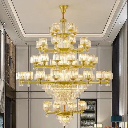 A multi-tiered golden decorbites crystal chandelier with clear glass shades and dangling crystals for elegant lighting