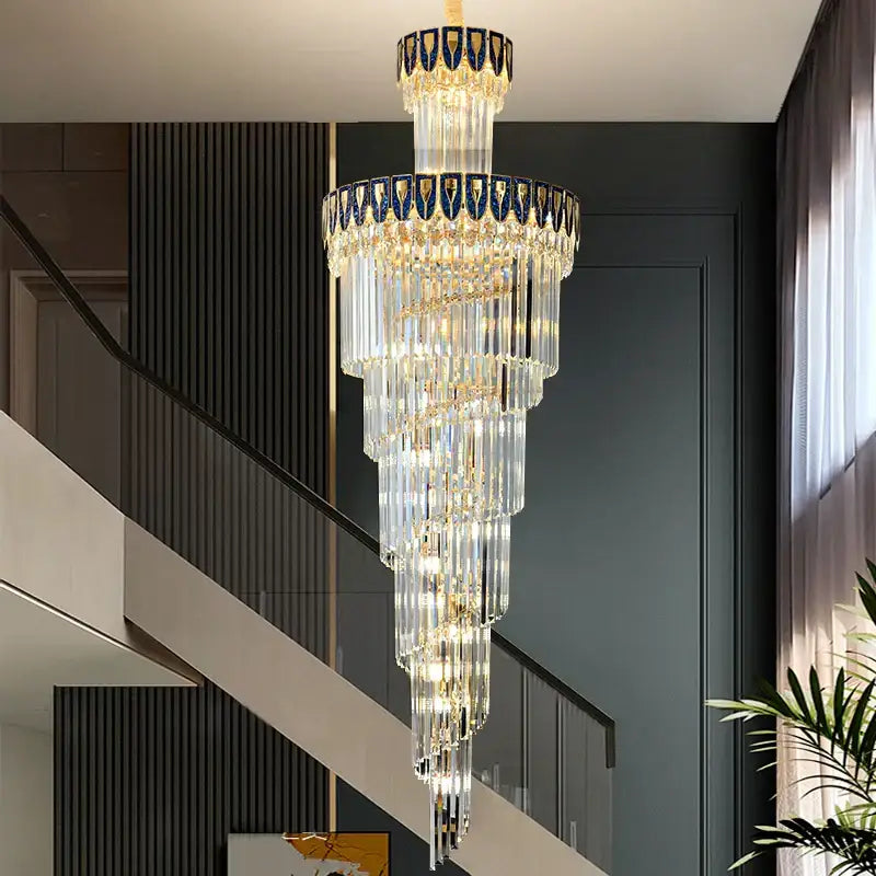 DecorBites crystal chandelier with cascading clear glass rods, gold accents, and blue black mosaic top ring for elegant villa lighting