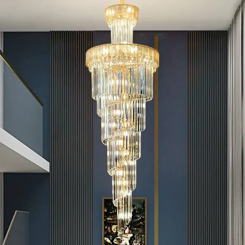 A decorbites crystal chandelier with gold-toned metal frame and cascading clear glass prisms for elegant villa lighting