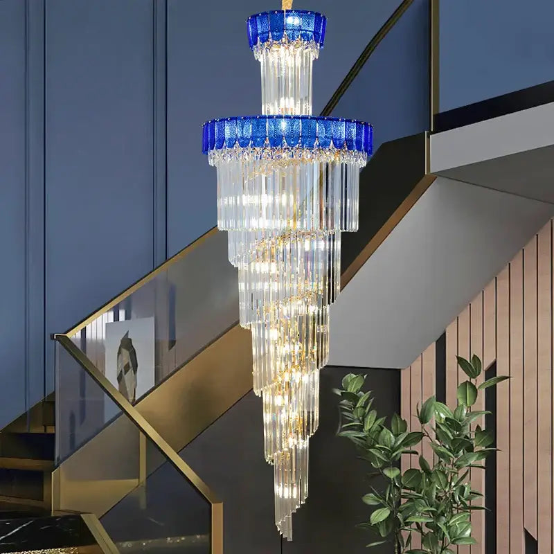 Decorbites crystal chandelier with cascading clear glass prisms and vibrant blue crystal accents for elegant villa lighting