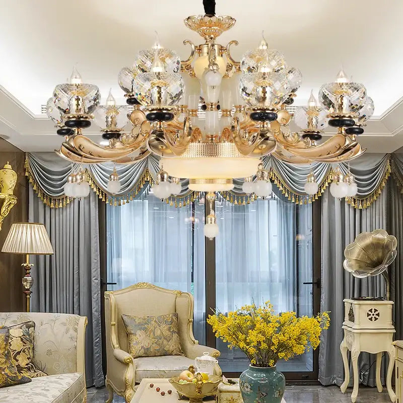 Gold-toned decorbites crystal chandelier with intricate ornate detailing and multiple tiers for living dining and bedroom