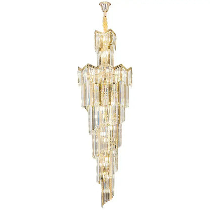 A tall elegant gold-toned decorbites crystal chandelier with cascading clear crystal prisms for luxury middle floor lighting
