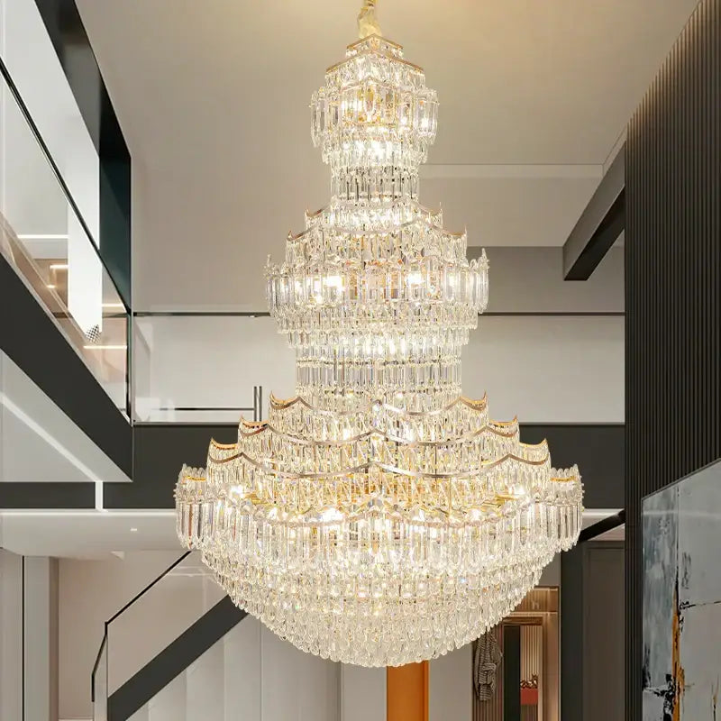 Decorbites crystal chandelier with gold-toned metal accents and cascading clear faceted crystals for villa lobby lighting