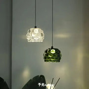 Two pendant lights with clustered bubble glass shades one clear and one emerald green from decorbites crystal chandelier for store cashier area