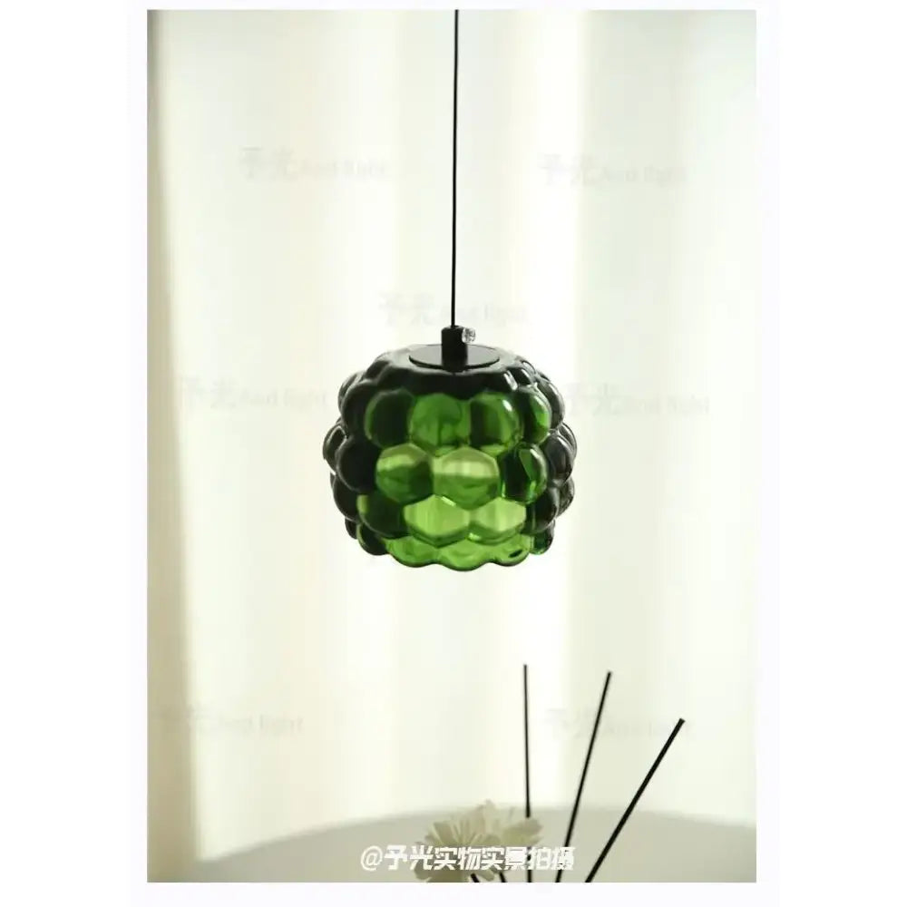 Green glass decorbites crystal chandelier pendant light with textured bubble design for clothing store cashier area