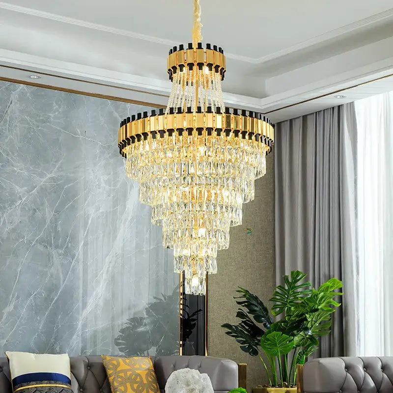A decorbites crystal chandelier with gold-toned metal frames and cascading clear prisms for villa and banquet halls
