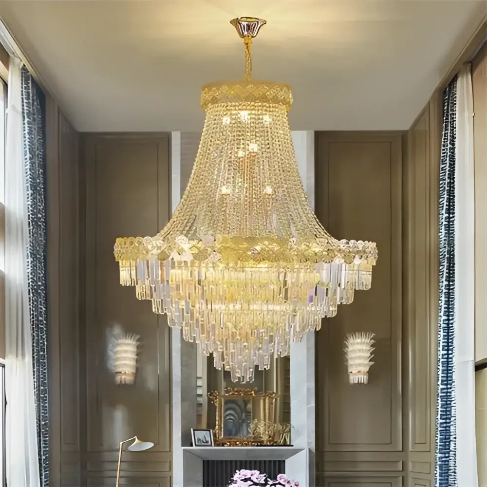 Golden decorbites crystal chandelier with cascading crystal prisms and intricate metalwork for duplex and villa living rooms