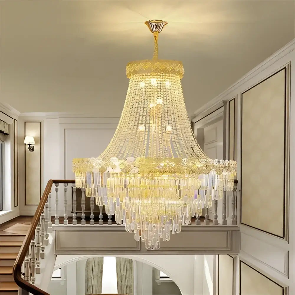 Golden decorbites crystal chandelier with cascading crystal droplets and tiered bell-shaped design for duplex living rooms
