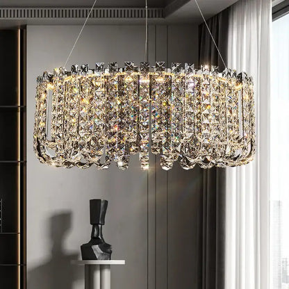 Decorbites crystal chandelier with faceted clear crystals in a modern cylindrical design for elegant european spaces