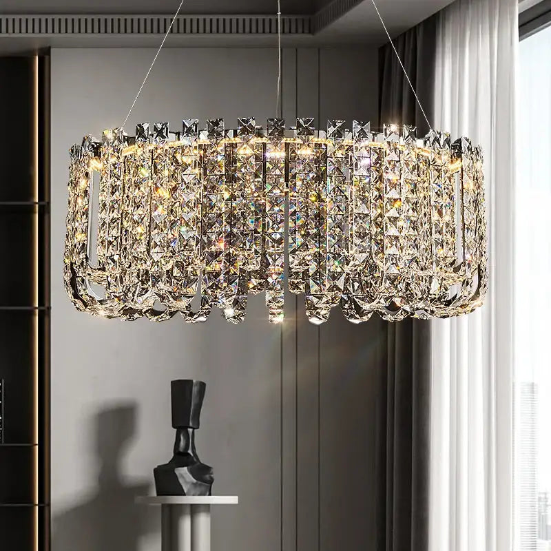 Decorbites crystal chandelier with faceted clear crystals in a modern cylindrical design for elegant european spaces